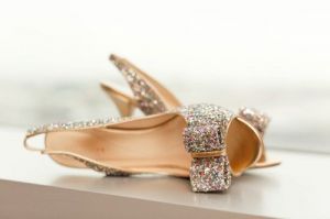 Photos of gold - glitter covered shoes with bow.jpg